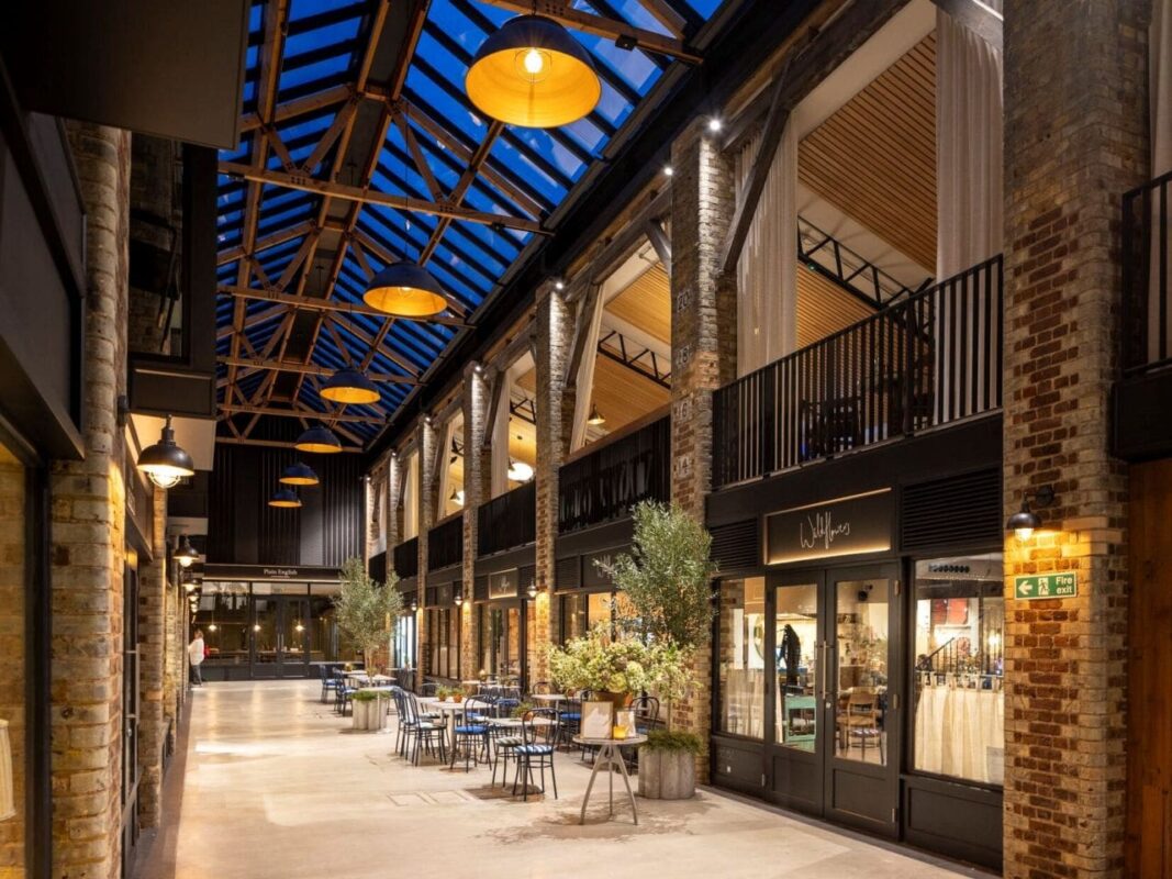 Newson's Yard, London, Pimlico Road, TESS 100 Blinds Refurbished building, retail, destination. Night time,, evening, rooflight. glow.