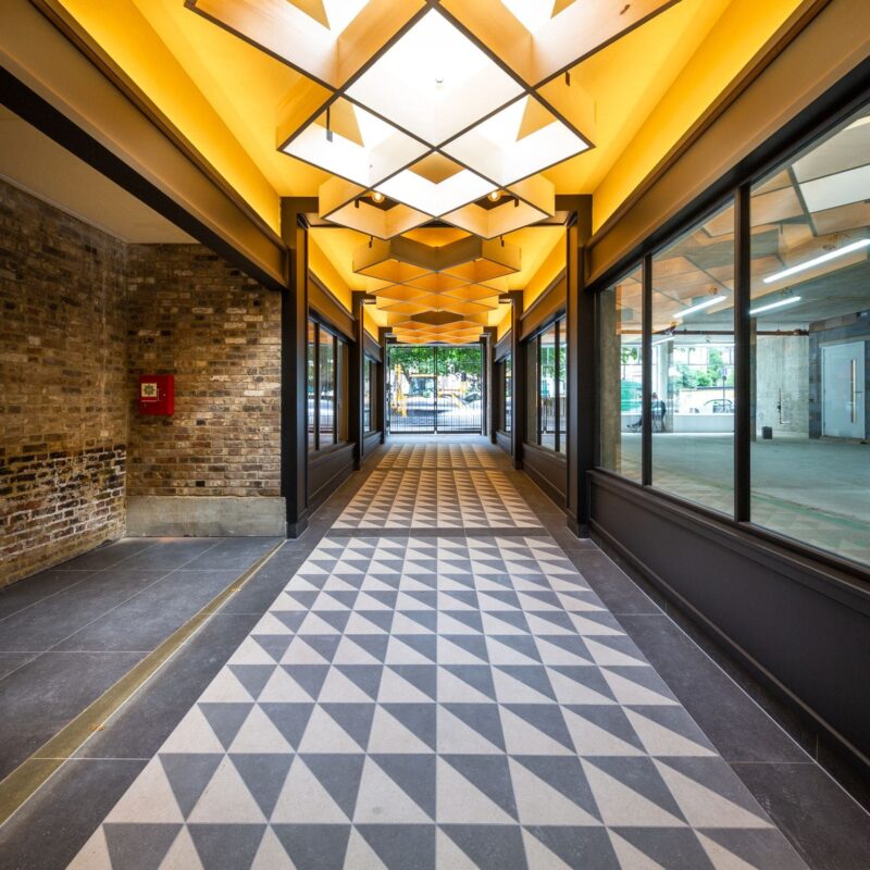 Newson's Yard, London, Pimlico Road, TESS 100 Blinds Refurbished building, retail, destination. Repurposed building, former timber yard, rooflight blinds. Shading solution. Guthrie Douglas.